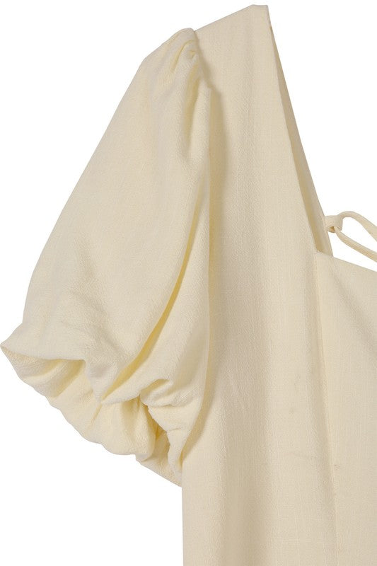 Scoop neck puff sleeve cream with back strap dress